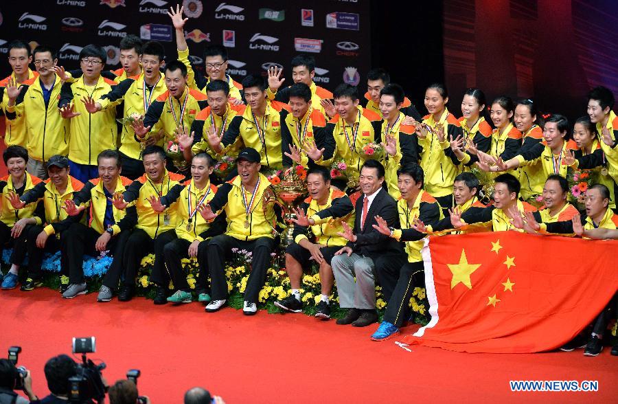 Players of China celebrate during the awarding ceremony after the final match against South Korea at the Sudirman Cup World Team Badminton Championships in Kuala Lumpur, Malaysia, on May 26, 2013. Team China won the champion with 3-0. (Xinhua/Chen Xiaowei)
