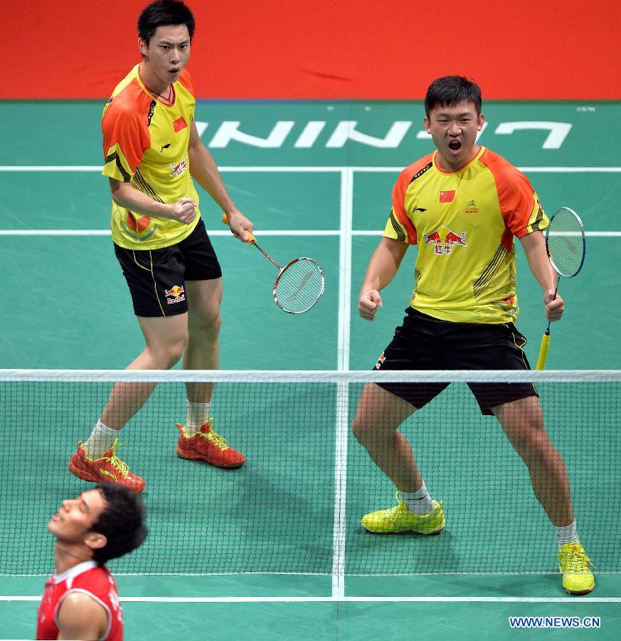 Liu Xiaolong (L) and Qiu Zihan of China celebrate during the men's doubles match against South Korea's Ko Sung Hyun/Lee Yong Dae at the finals of the Sudirman Cup World Team Badminton Championships in Kuala Lumpur, Malaysia, on May 26, 2013. Team China won the champion with 3-0. (Xinhua/Chen Xiaowei)