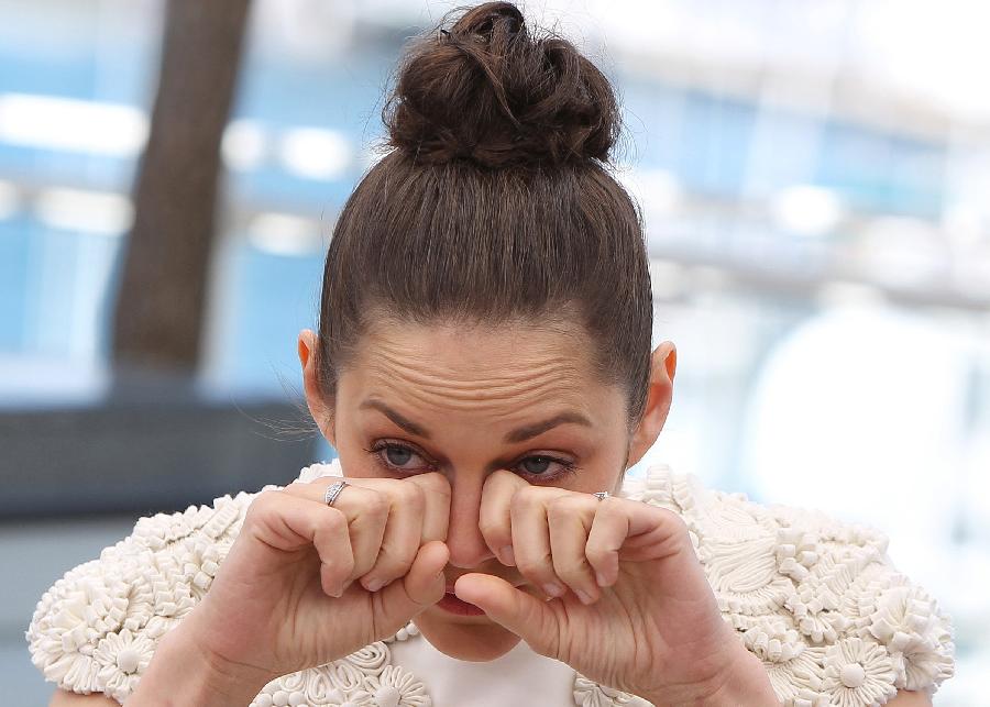 French actress Marion Cotillard reacts during a photocall for the film "The Immigrant" at the 66th edition of the Cannes Film Festival in Cannes, on May 24, 2013. (Xinhua/Gao Jing)