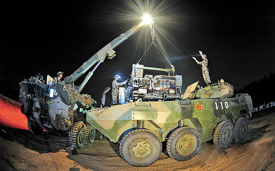 Troops in night equipment support drill