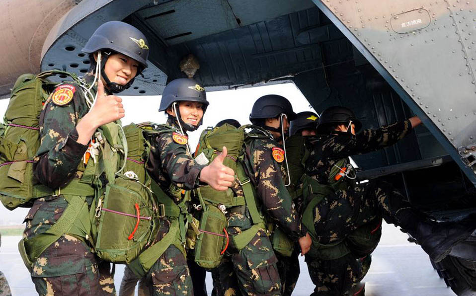 Female special operation members in parachute landing training