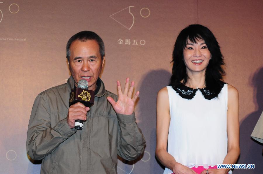 Hou Hsiao-hsien (L), chairman of Golden Horse Film Festival, and actress Maggie Cheung attend a press conference marking the beginning of the 50th anniversary celebration of the Festival in Taipei, southeast China's Taiwan, May 27, 2013. Maggie Cheung, the actress who won the most Golden Horse Awards so far, is appointed as the 2013 Golden Horse Film Festival Ambassador on Monday. (Xinhua) 
