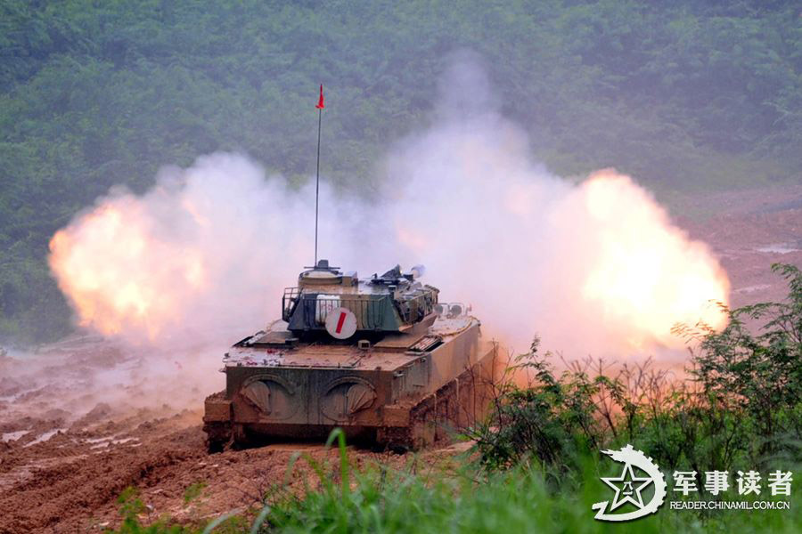 An amphibious armored brigade under the Nanjing Military Area Command (MAC) of the Chinese People's Liberation Army (PLA) takes its troops to unfamiliar area on May 26, 2013 to conduct live-ammunition firing training. (China Military Online/Jiang Jiangao)