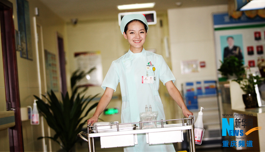 Yang Ruihan, born in 1987, is a nurse in Chongqiing South West Hospital. (Xinhua/Peng Bo)