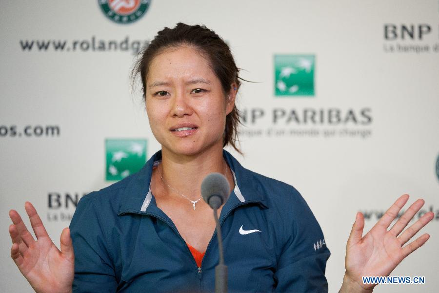 Li Na of China speaks at the post match press conference after winning her women's singles first round match against Anabel Medina Garrigues of Spain on day 2 of the 2013 French Open tennis tournament at Roland Garros in Paris, France on May 27, 2013. Li Na won 2-0. (Xinhua/Bai Xue)