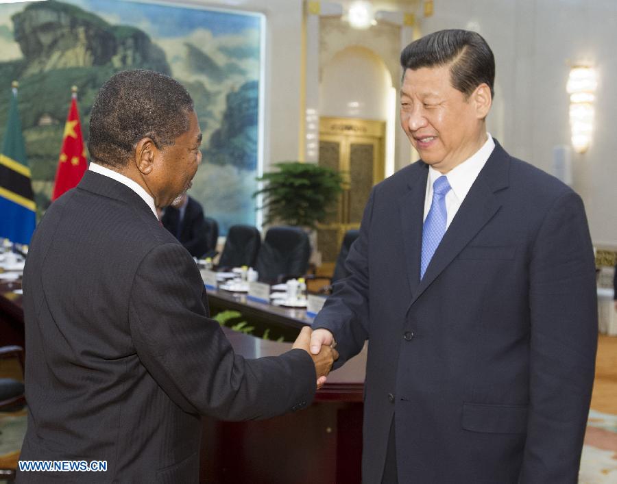 Chinese President Xi Jinping (R) shakes hands with Zanzibar President Ali Mohamed Shein during their meeting in Beijing, capital of China, May 28, 2013. (Xinhua/Huang Jingwen)