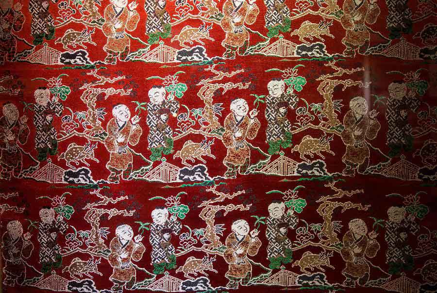 Photo taken on May 27, 2013 shows part of an artwork of Shu brocade, in Chengdu, capital of southwest China's Sichuan Province. Imparted from generation to generation for over 2,000 years, Shu brocade weaving techniques have been put on China's Intangible Cultural Heritage List in 2006. (Xinhua/Li Qiaoqiao)