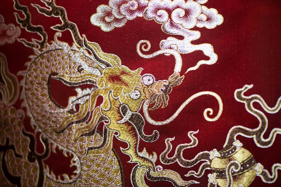 Photo taken on May 27, 2013 shows part of an artwork of Shu brocade, in Chengdu, capital of southwest China's Sichuan Province. Imparted from generation to generation for over 2,000 years, Shu brocade weaving techniques have been put on China's Intangible Cultural Heritage List in 2006. (Xinhua/Li Qiaoqiao) 