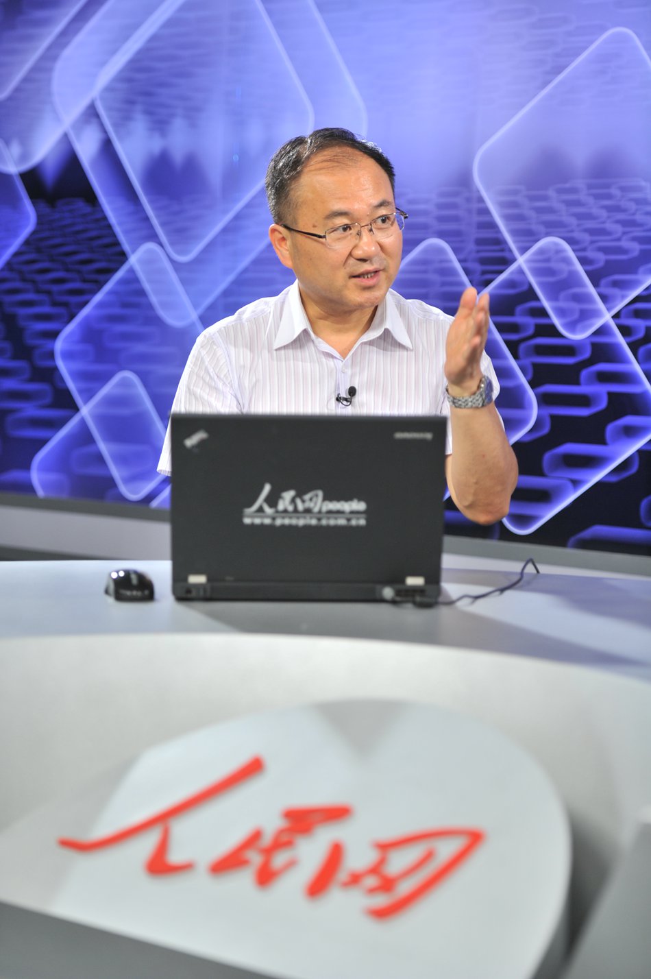 The Vice President of Communication University of China Hu Zhengrong receives a video interview with People's Daily Online.(People's Daily Online/Yu Kai)