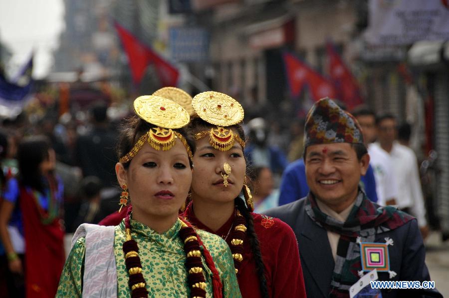 Nepali people in traditional attire participate in the celebrations to mark the Mt. Qomolangma Diamond Jubilee in Kathmandu, Nepal, May 29, 2013. The families of Edmund Hillary and Sherpa Tenzing Norgay are celebrating on Wednesday the 60th anniversary of the first ascent of Mt. Qomolangma in human history when the two heroes reached the summit. (Xinhua/Sunil Pradhan) 