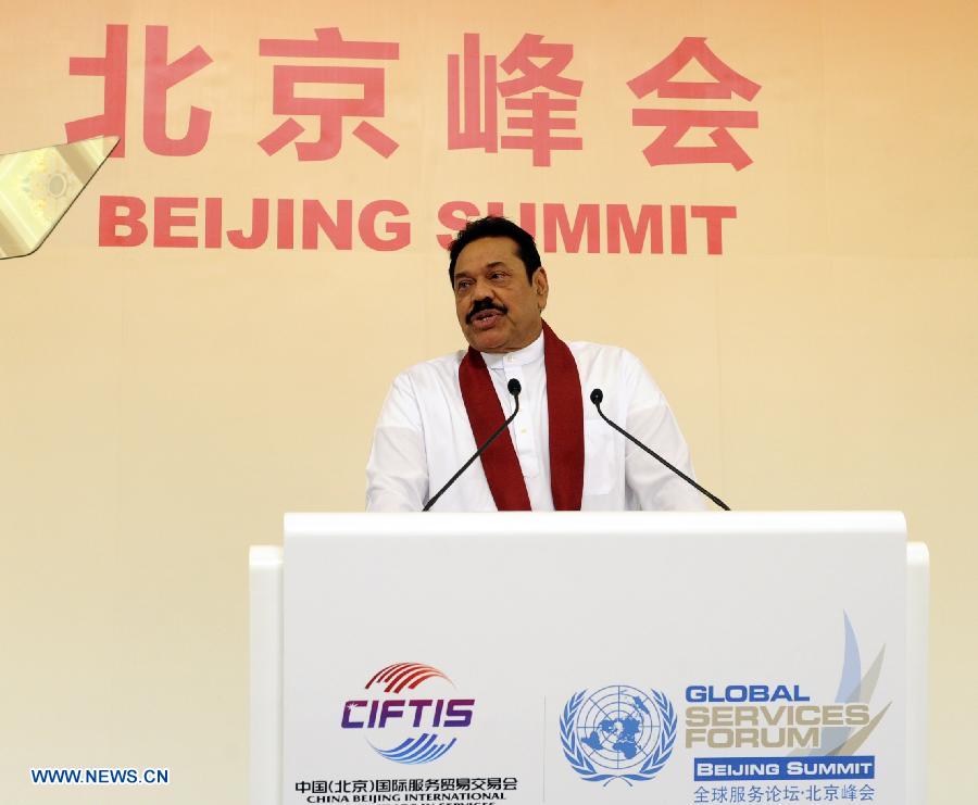 Sri Lankan President Mahinda Rajapaksa addresses the 2nd China Beijing International Fair for Trade in Services (CIFITIS) and Global Services Forum-Beijing Summit in Beijing, capital of China, May 29, 2013. (Xinhua/Rao Aimin)  