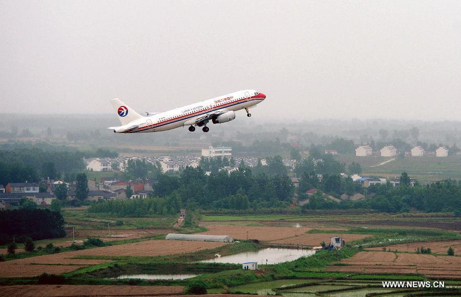 A plane leaves the Hefei Xinqiao International Airport in east China's Anhui Province, May 30, 2013. Located in Gaoliu Town of Feixi County, 31.8 kilometers away from the center of Hefei City, Xinqiao International Airport has replaced Luogang International Airport as Hefei's main airport. (Xinhua/Ma Qibing)