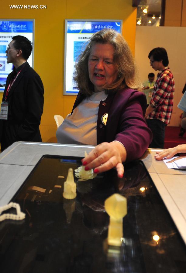 A visitor views 3D-printed products at the International Design Expo in Beijing, capital of China, May 30, 2013. Opened Thursday, the expo is part of the 2013 China Design Festival from May 30 to June 1 in Beijing's Daxing District. (Xinhua/He Canling) 