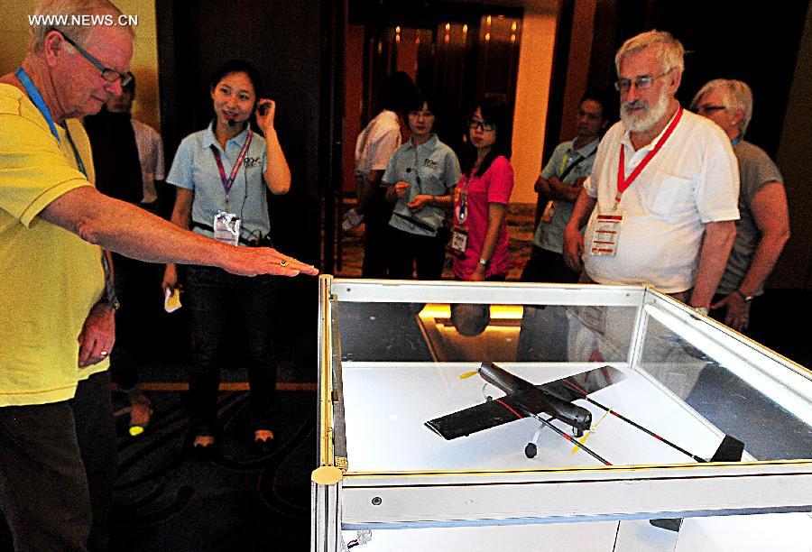 Visitors view the model of disaster prevention and mitigation drone at the International Design Expo in Beijing, capital of China, May 30, 2013. Opened Thursday, the expo is part of the 2013 China Design Festival from May 30 to June 1 Beijing's Daxing District. (Xinhua/He Canling) 
