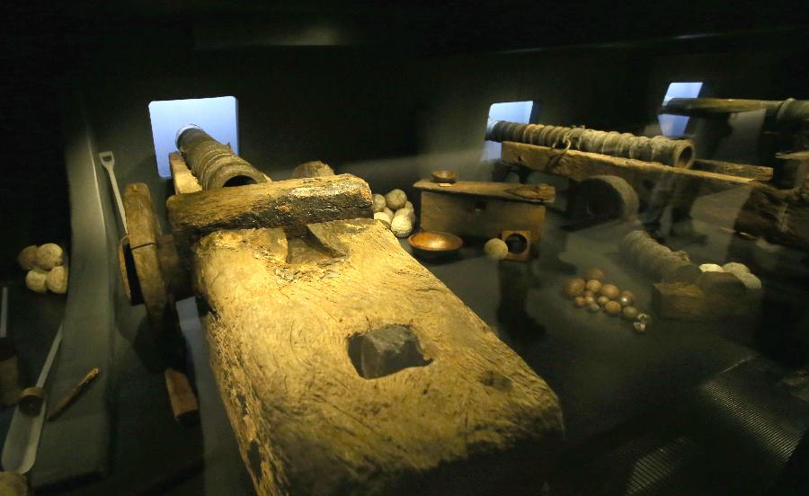 Cannons of the Mary Rose are seen at Mary Rose museum in south England's Portsmouth, April 25, 2013. The Mary Rose museum opened here on May 31, 2013. The new museum, at the historic dockyard in Portsmouth and in the shape of the bow of a black ship, was aimed at taking visitors to a journey through 500 years, so as to learn the story of the Mary Rose, one of the largest and most famous ships in the English navy. (Xinhua/Yin Gang)