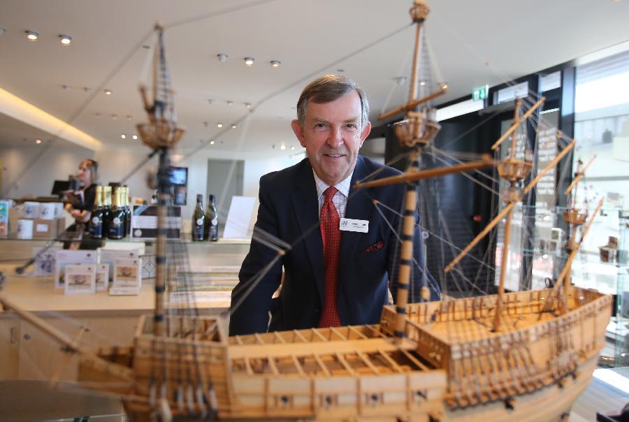 Rear-Admiral John Lippiett, chief executive of the Mary Rose Trust, poses with a replica of the Mary Rose at Mary Rose museum in south England's Portsmouth, April 25, 2013. The Mary Rose museum opened here on May 31, 2013. The new museum, at the historic dockyard in Portsmouth and in the shape of the bow of a black ship, was aimed at taking visitors to a journey through 500 years, so as to learn the story of the Mary Rose, one of the largest and most famous ships in the English navy. (Xinhua/Yin Gang) 