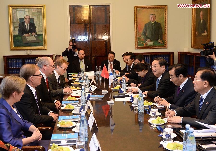 Yu Zhengsheng (3rd R), chairman of the National Committee of the Chinese People's Political Consultative Conference, holds talks with Finnish Parliament Speaker Eero Heinaluoma (3rd L) in Helsinki, Finland, May 31, 2013. (Xinhua/Liu Jiansheng)