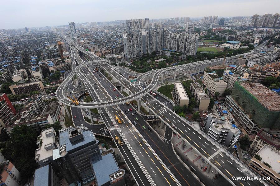 Photo taken on May 24, 2013 shows the Yingmenkou flyover in Chengdu, capital of southwest China's Sichuan Province. By the end of 2012, Chengdu's GDP has reached 800 billion RMB (about 130.48 billion U.S. dollars), ranking the 3rd place in China's sub-provincial cities. By May of 2013, more than 230 enterprises in the Fortune 500 have come to Chengdu. The 2013 Fortune Global Forum will be held in Chengdu from June 6 to June 8. Chengdu, an ancient city with a history of over 2,300 year, is developing into an international metropolis with its huge economic development potential as well as its special cultural environment. (Xinhua/Li Hualiang)
