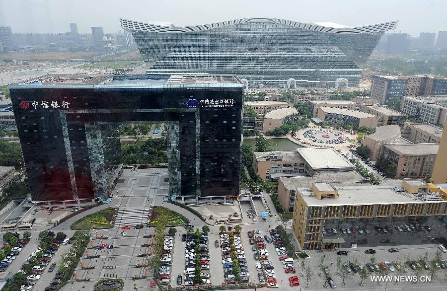 Photo taken on May 29, 2013 shows the scene of high-tech zone in Chengdu, capital of southwest China's Sichuan Province. By the end of 2012, Chengdu's GDP has reached 800 billion RMB (about 130.48 billion U.S. dollars), ranking the 3rd place in China's sub-provincial cities. By May of 2013, more than 230 enterprises in the Fortune 500 have come to Chengdu. The 2013 Fortune Global Forum will be held in Chengdu from June 6 to June 8. Chengdu, an ancient city with a history of over 2,300 year, is developing into an international metropolis with its huge economic development potential as well as its special cultural environment. (Xinhua/Xue Yubin)