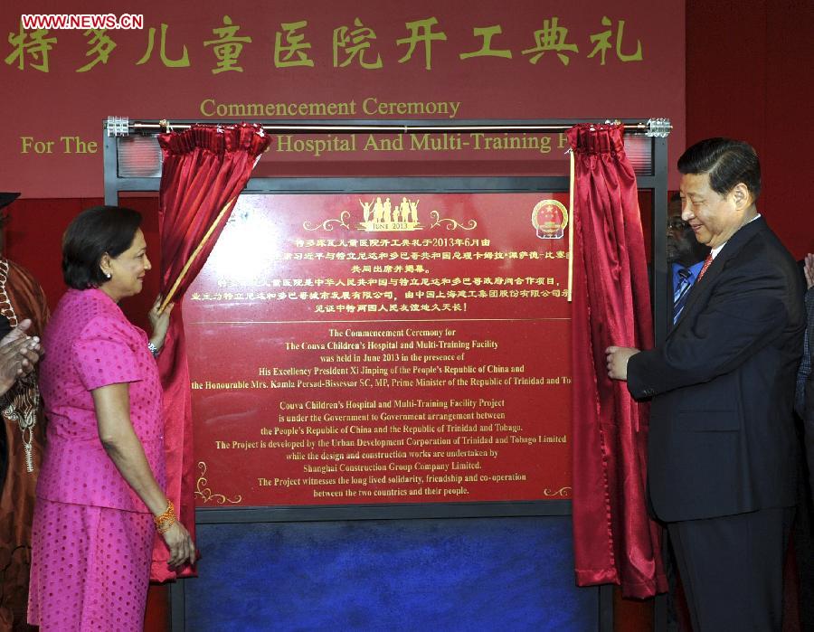 Chinese President Xi Jinping (R) and Trinidad and Tobago Prime Minister Kamla Persad-Bissessar attend the commencement ceremony for the Couva Children's Hospital and Multi-Training Facility in Couva, central Trinidad and Tobago, June 1, 2013. (Xinhua/Rao Aimin)