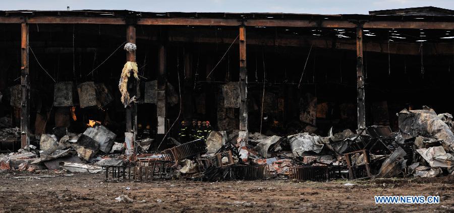 Photo taken on June 3, 2013 show the burnt poultry slaughterhouse owned by the Jilin Baoyuanfeng Poultry Company in Mishazi Township of Dehui City in northeast China's Jilin Province. The death toll from the fire has risen to 119 as of 8 p.m. on Monday. Search and rescue work is under way. (Xinhua/Wang Hao Fei)