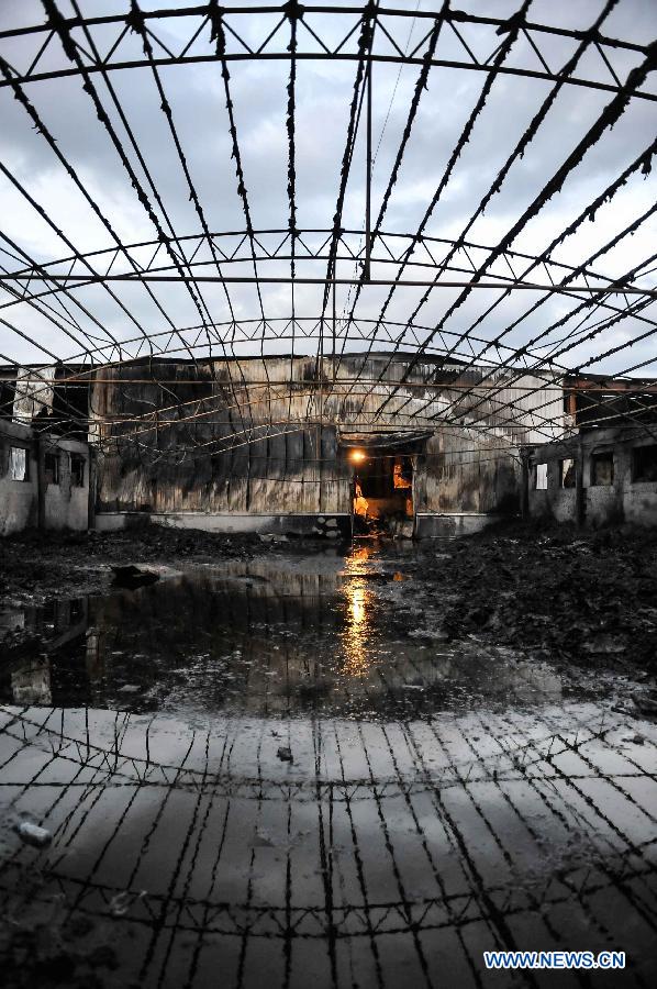 Photo taken on June 3, 2013 show the burnt poultry slaughterhouse owned by the Jilin Baoyuanfeng Poultry Company in Mishazi Township of Dehui City in northeast China's Jilin Province. The death toll from the fire has risen to 119 as of 8 p.m. on Monday. Search and rescue work is under way. (Xinhua/Wang Hao Fei)