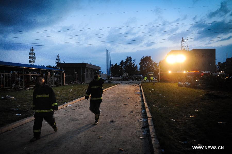 Firemen are seen at the burnt poultry slaughterhouse owned by the Jilin Baoyuanfeng Poultry Company in Mishazi Township of Dehui City in northeast China's Jilin Province, June 3, 2013. The death toll from the fire has risen to 119 as of 8 p.m. on Monday. Search and rescue work is under way. (Xinhua/Xu Chang)