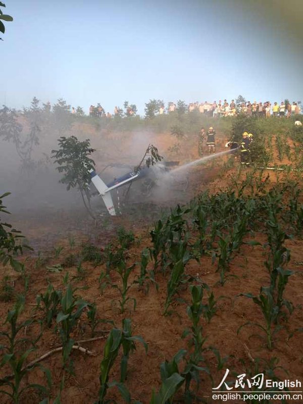 A police helicopter of the public security bureau of Xi'an, capital city of northwest China’s Shaanxi province, crashes near a village in Lantian county around 6 p.m. on June 3, 2013, killing two people and injuring one. (Photo/CFP)