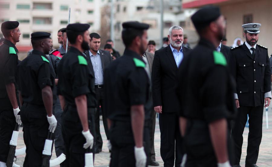 Prime Minister of the de facto Hamas government in Gaza Ismail Haneya (3rd, R) attends a graduation ceremony of police officers at the police academy in Gaza City, on March 19, 2013. (Xinhua/Wissam Nassar) 