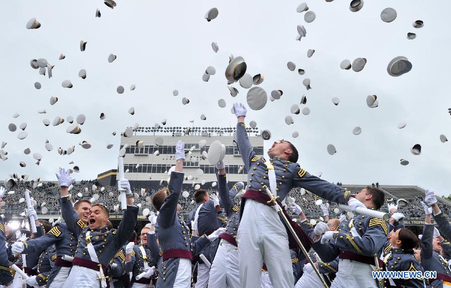 Graduating cadets toss their hats during the graduation ceremonies at the United States Military Academy at West Point, New York, the United States, May 25, 2013. 1,007 cadets graduated on Saturday from the famous military academy founded in 1802. (Xinhua/Wang Lei)