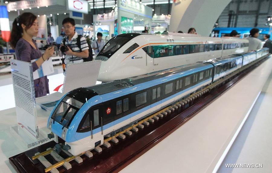 Train models are displayed on the exhibition "Rail + Metro China 2013" in Shanghai, east China, June 4, 2013. The exhibition, showcasing metro and rail-related technologies and products worldwide, kicked off here Tuesday. (Xinhua/Pei Xin)