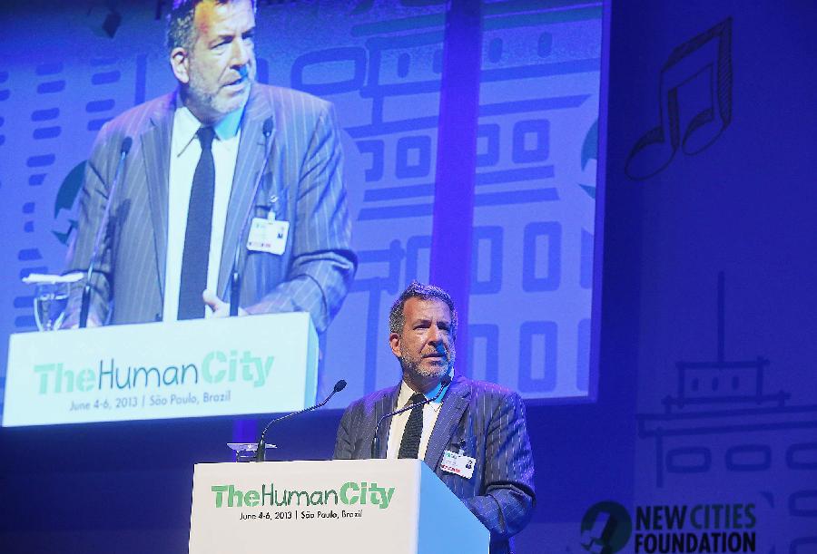 John Rossant, founder and Chairman of the New Cities Foundation, speaks during the opening of the "New Cities Summit 2013-The Human City", in Sao Paulo, Brazil, on June 4, 2013. The event that will be held in Sao Paulo until June 6, brings together experts from around the world to discuss topics such as security, transportation, health and environment in the urban transformation process. (Xinhua/Rahel Patrasso) 