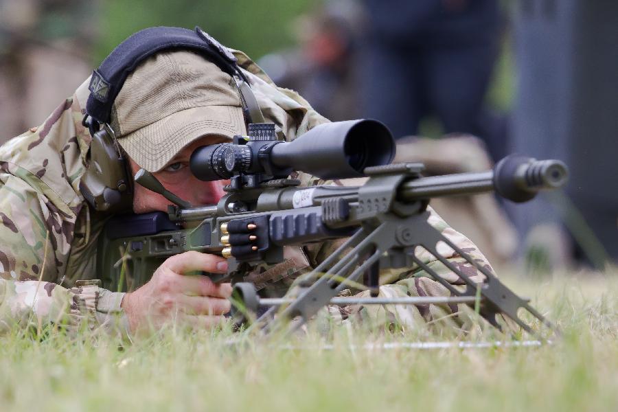 A participant competes during the 12th Police and Military Sniper World Cup in Budapest, Hungary, on June 4, 2013. (Xinhua/Attila Volgyi) 