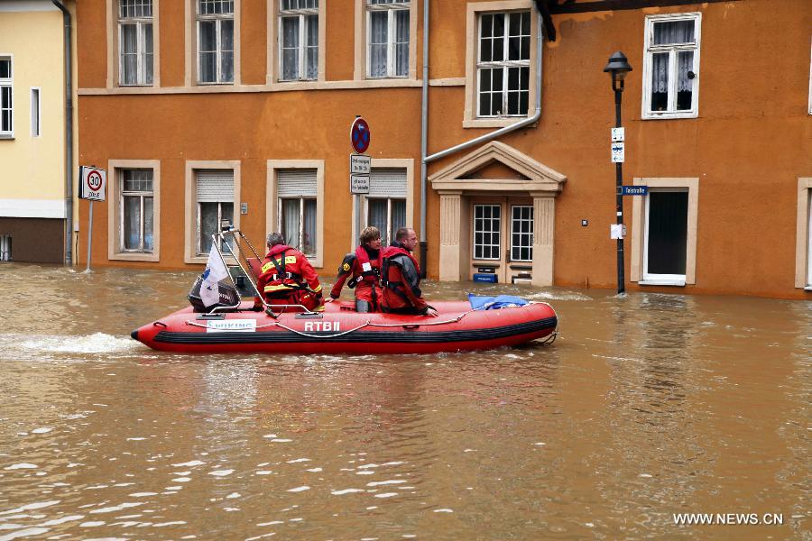 Workers carry out search and rescue operation in a hovercraft on the flooded street in Halle, eastern Germany, on June 4, 2013. The water level of Saale River across Halle City is expected to rise up to its historical record of 7.8 meters in 400 years, due to persistent heavy rains in south and east Germany. (Xinhua/Pan Xu) 