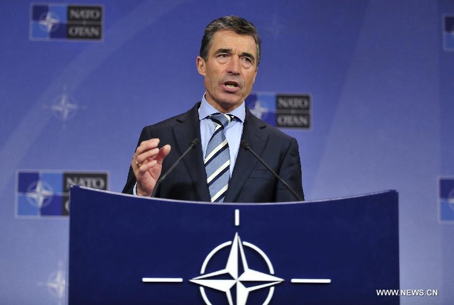 NATO Secretary General Anders Fogh Rasmussen addresses a press conference after two-days NATO Defence Ministers Meeting at its headquarters in Brussels, capital of Belgium, June 5, 2013. (Xinhua/Ye Pingfan)  