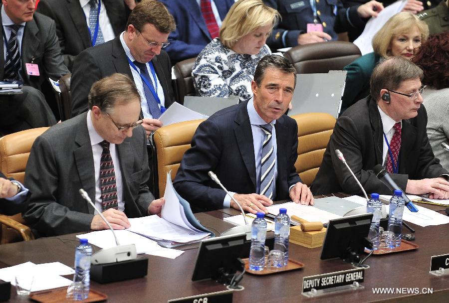 NATO Secretary General Anders Fogh Rasmussen (C) holds a NATO and non-NATO ISAF contributing nations meeting during two-days NATO Defence Ministers Meeting at its headquarters in Brussels, capital of Belgium, June 5, 2013. (Xinhua/Ye Pingfan)