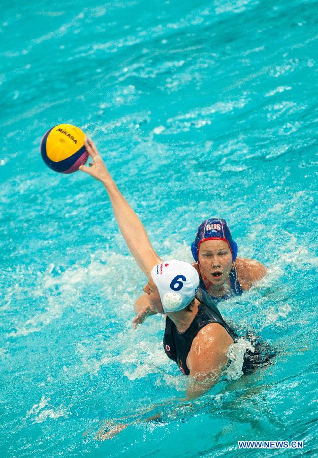 Takacs Orsolya (Front) of Hungary competes during the semifinal against Russia at the 2013 FINA Women's Water Polo World League Super Final in Beijing, capital of China, June 5, 2013. Russia won 12-9. (Xinhua/Zhang Yu)