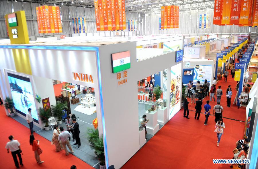People visit the first China-South Asia Expo in Kunming, capital of southwest China's Yunnan Province, June 6, 2013. The five-day China-South Asia Expo opened here on Thursday, attracting over 1,400 exhibitors from Asian countries and regions. (Xinhua/Chen Haining)