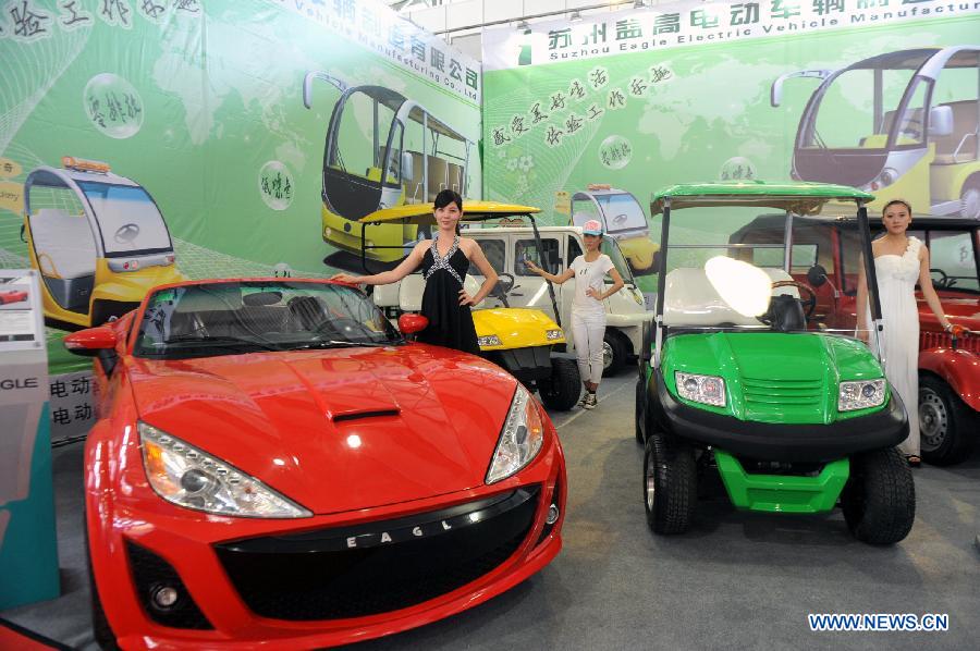 Electric vehicles are displayed at the first China-South Asia Expo in Kunming, capital of southwest China's Yunnan Province, June 6, 2013. The five-day China-South Asia Expo opened here on Thursday, attracting over 1,400 exhibitors from Asian countries and regions. (Xinhua/Chen Haining)