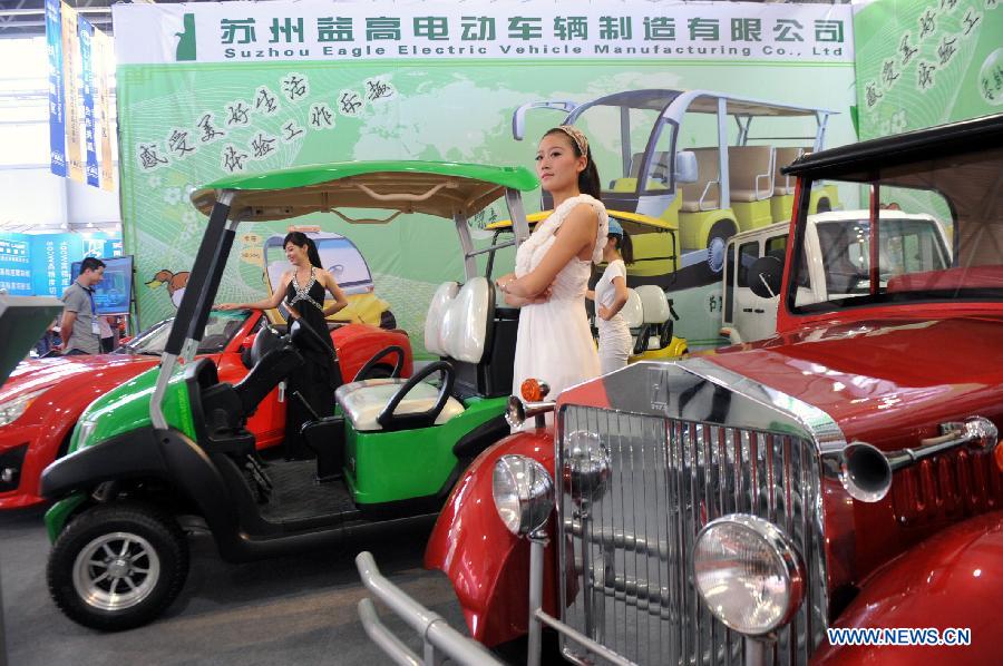 Electric vehicles are displayed at the first China-South Asia Expo in Kunming, capital of southwest China's Yunnan Province, June 6, 2013. The five-day China-South Asia Expo opened here on Thursday, attracting over 1,400 exhibitors from Asian countries and regions. (Xinhua/Chen Haining)