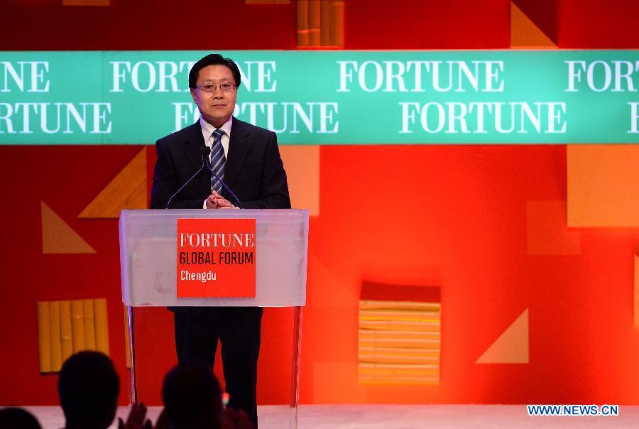 Wang Dongming, Secretary of the Sichuan Provincial Committee of the Communist Party of China, attends the opening ceremony of the 2013 Fortune Global Forum in Chengdu, capital of southwest China's Sichuan Province, June 6, 2013. (Xinhua/Jin Liangkuai)