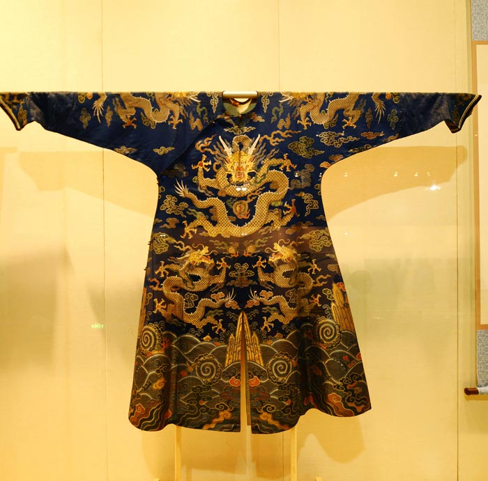 Blue satin robe with gold-threaded boa design in Qing Dynasty. (China Daily/Ju Chuanjiang)