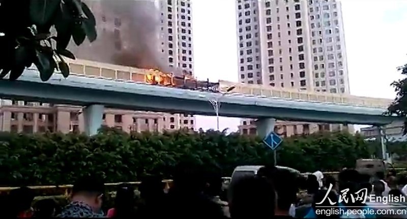 A bus bursts into flames on an elevated track in East China's Fujian province on Friday evening. (Photo/Xinhua)