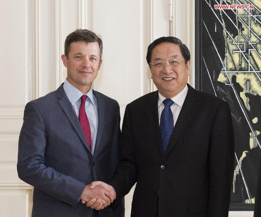 Yu Zhengsheng (R), chairman of the National Committee of the Chinese People's Political Consultative Conference, meets with Denmark's Crown Prince Frederik in Copenhagen, Denmark, June 6, 2013. (Xinhua/Li Xueren)