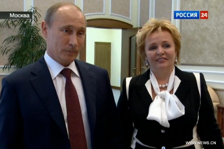 Image taken from video shows Russian President Vladimir Putin and his wife Lyudmila Putina being interviewed in a program on a local news TV channel on June 6, 2013. Putin and his wife Lyudmila Putina on Thursday announced their divorce. (Xinhua)