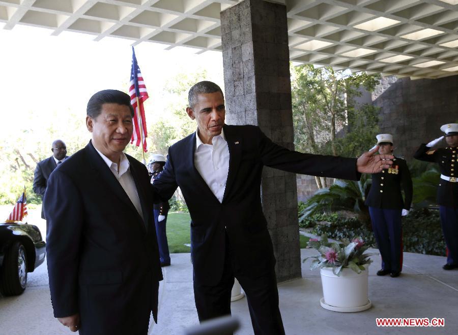 Chinese President Xi Jinping is greeted by U.S. President Barack Obama at the Annenberg Retreat, California, the United States, June 7, 2013. Chinese President Xi Jinping and his U.S. counterpart, Barack Obama, met Friday to exchange views on major issues of common concern. (Xinhua/Lan Hongguang)