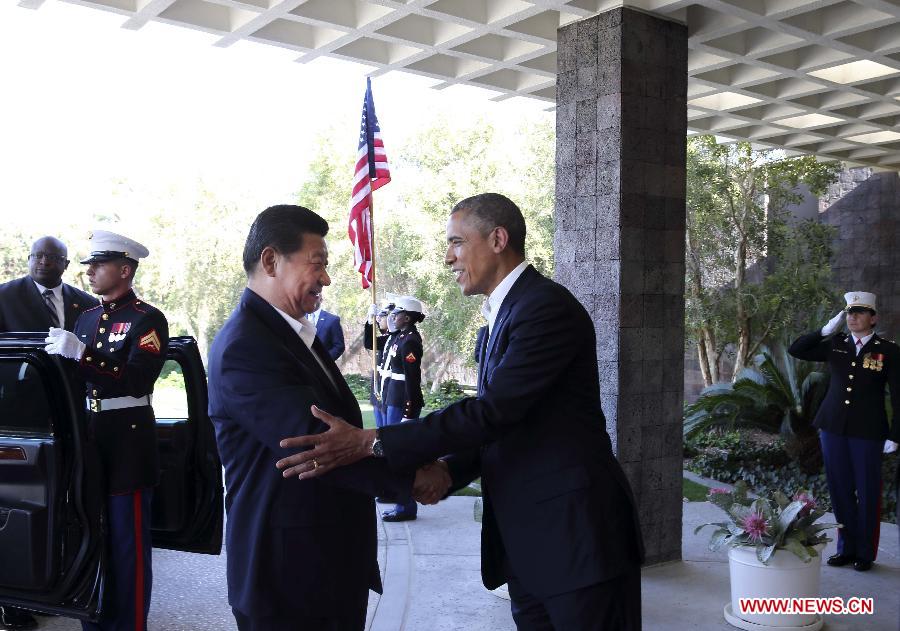 Chinese President Xi Jinping (L, front) shakes hands with U.S. President Barack Obama at the Annenberg Retreat, California, the United States, June 7, 2013. Chinese President Xi Jinping and his U.S. counterpart, Barack Obama, met Friday to exchange views on major issues of common concern. (Xinhua/Lan Hongguang)
