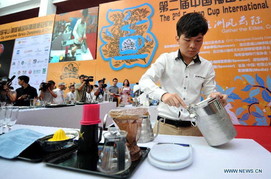 A barista competes during the 2nd Fushan Cup international Barista Championship of China in Chengmai, south China's Hainan Province, June 9, 2013. A total of 24 baristas around the world participated in the championship. (Xinhua/Guo Cheng) 