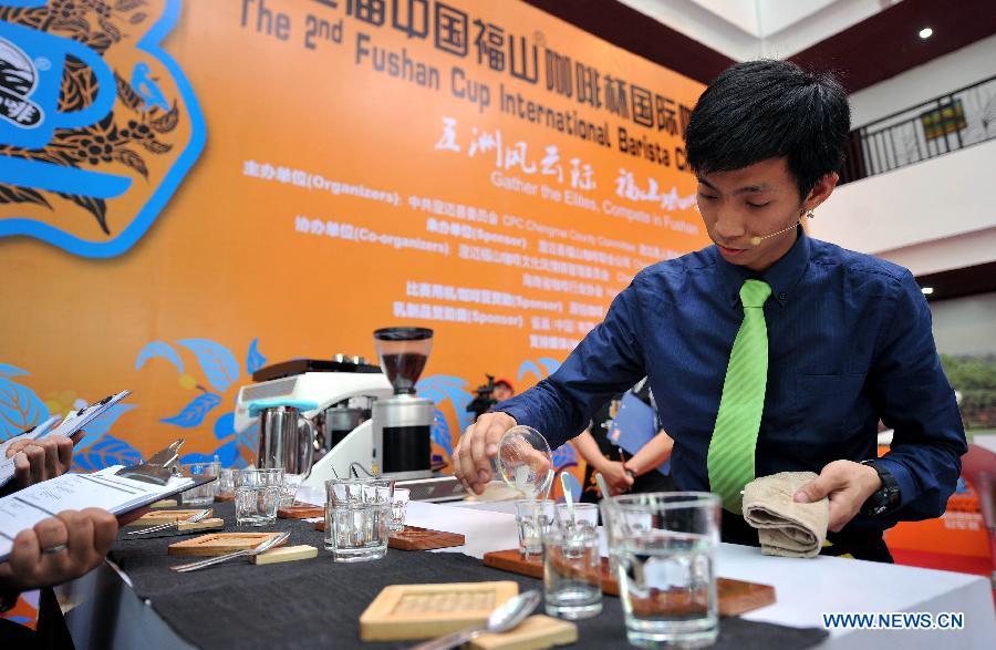 A barista competes during the 2nd Fushan Cup international Barista Championship of China in Chengmai, south China's Hainan Province, June 9, 2013. A total of 24 baristas around the world participated in the championship. (Xinhua/Guo Cheng)