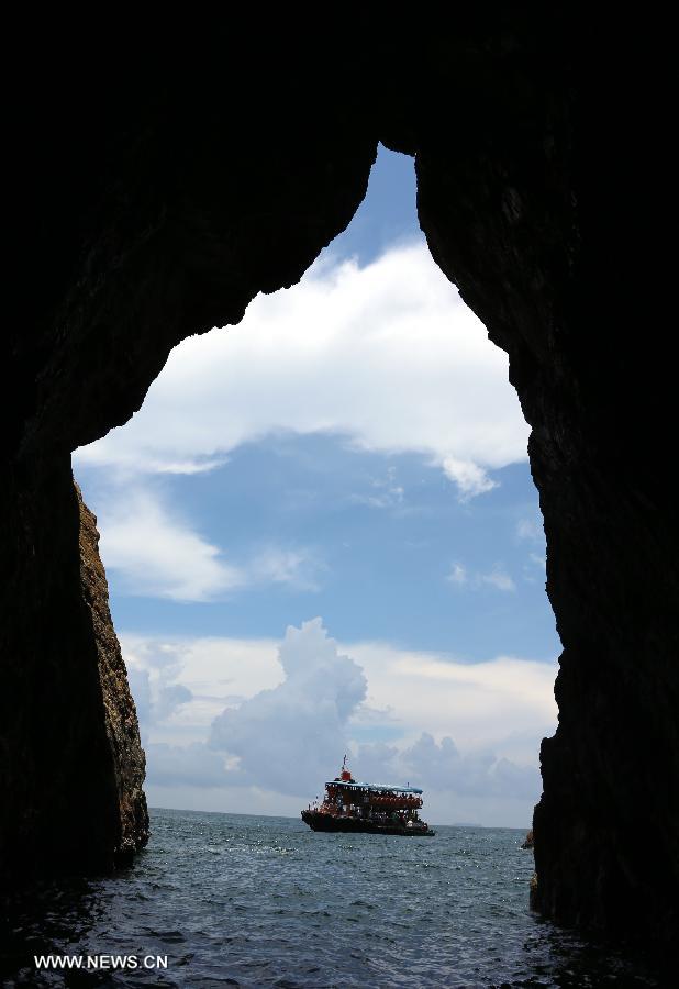 Photo taken on June 9, 2013 shows the scenery outside a cave of the South Ninepin Island in Hong Kong, south China. The Ninepin Group, or Kwo Chau Islands, is a group of islands in the southeastern Hong Kong. (Xinhua/Li Peng)